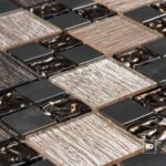 Malla30x30-paola-cenezzia-2-ok | Plomería García Close-up of square chocolate bars arranged in a grid with glossy melted centers.