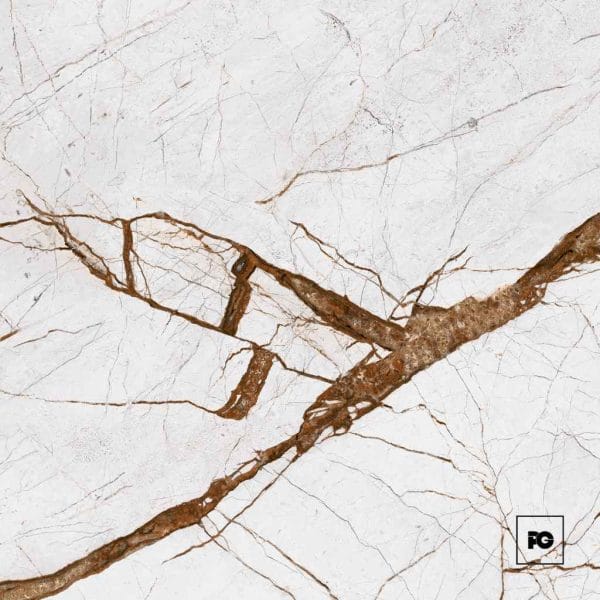 White marble surface with bold brown veins running diagonally and a small fg logo in the bottom-right corner