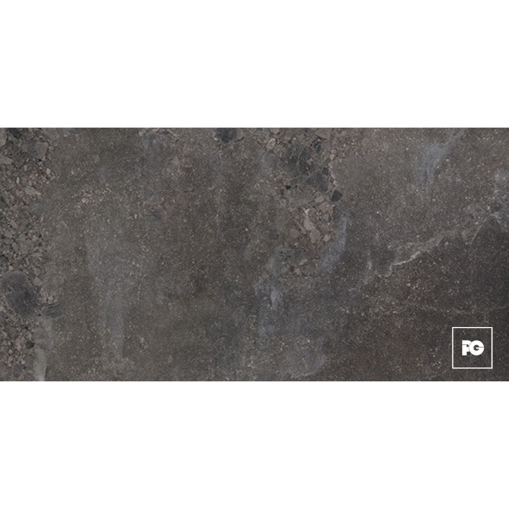 Rough concrete surface with small rocks, featuring a white outlined square logo containing 'PG' in the bottom-right corner of the image.