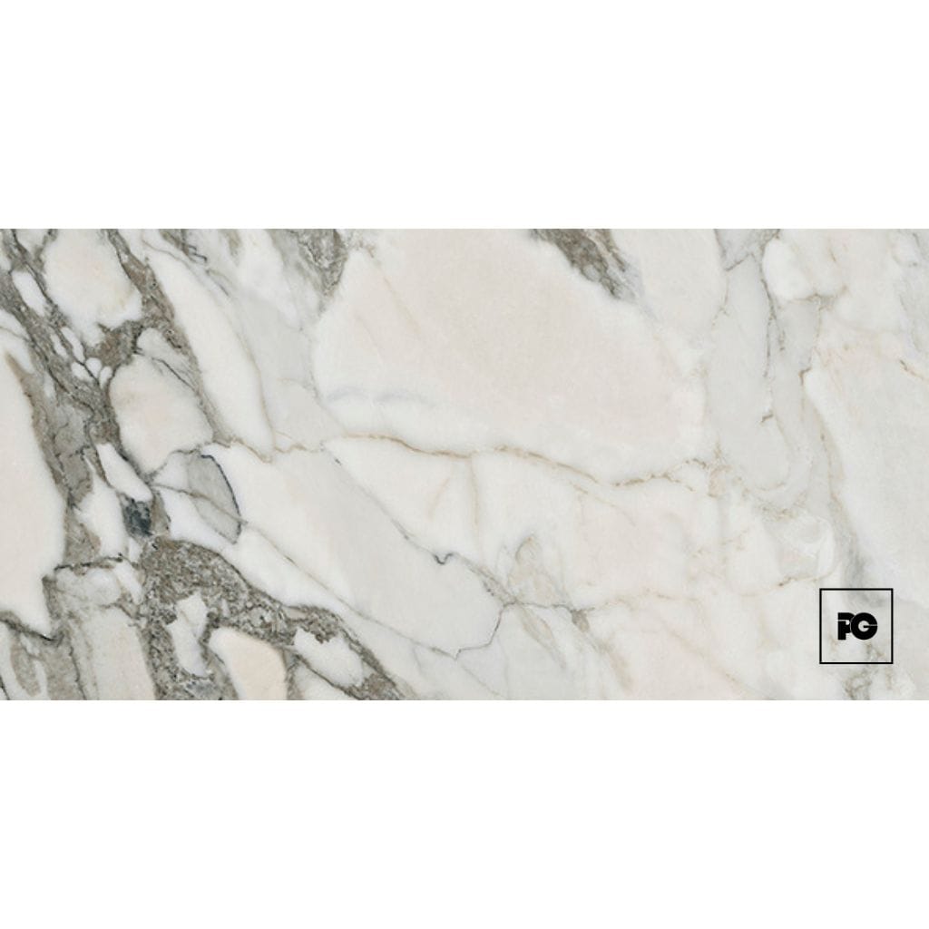 White marble slab with gray veining and a small black-bordered PG logo in the lower-right corner.