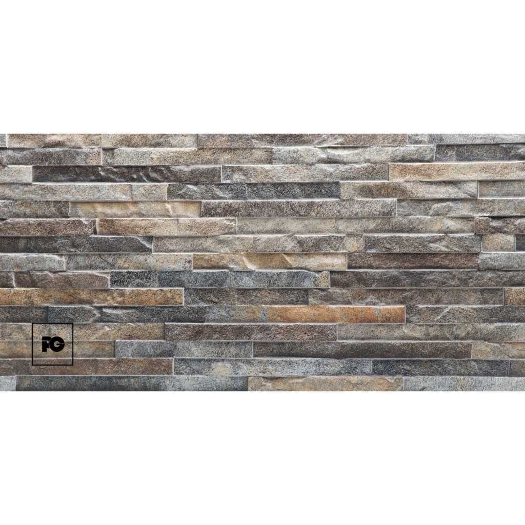 Stone veneer wall with irregular gray-brown stones and a small black FG logo in a square at the lower-left corner